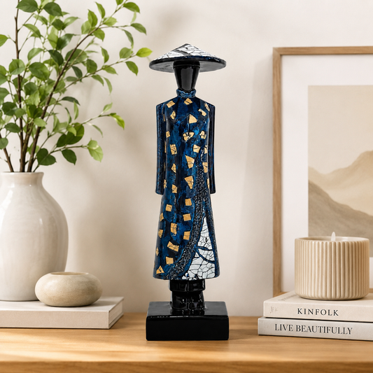 Vietnamese lacquer Ao Dai lady statue displayed on a modern bookshelf as home decor.